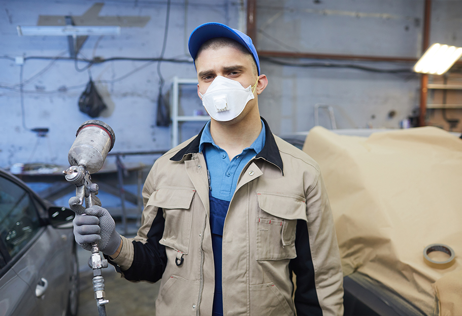 Automotive painter using a respirator