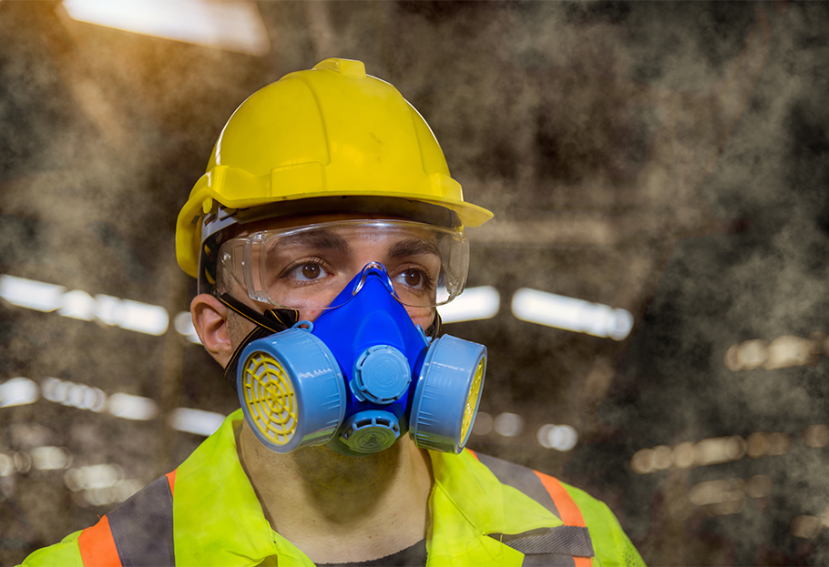 Chemical worker wearing a respirator