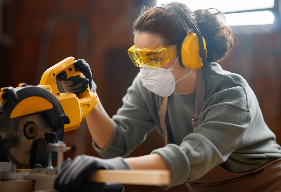 Construction worker using a respirator