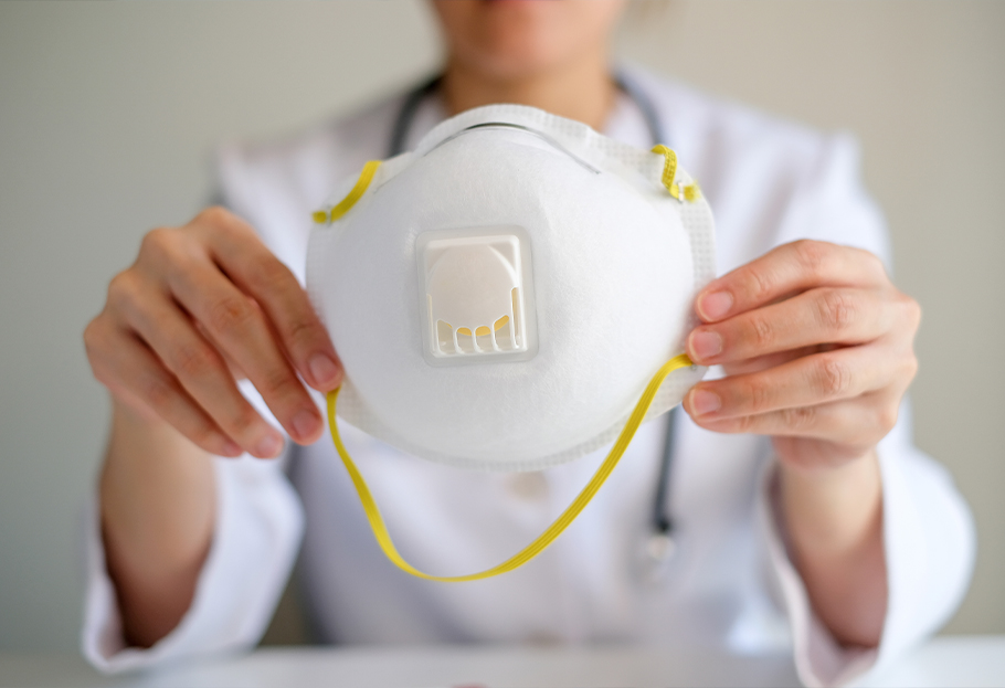 Doctor holding a respirator