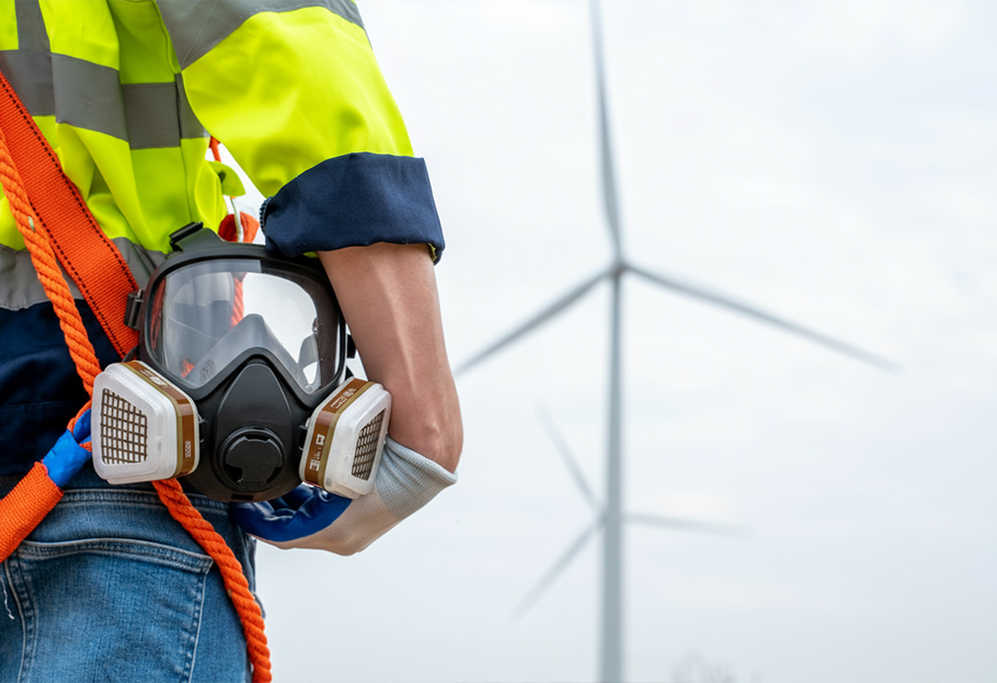 Renewable Energy Worker holding a Respirator