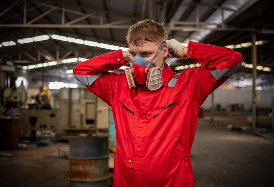 Worker at Chemical Facility with Respirator